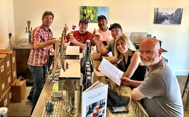 People enjoying a good wine at the table