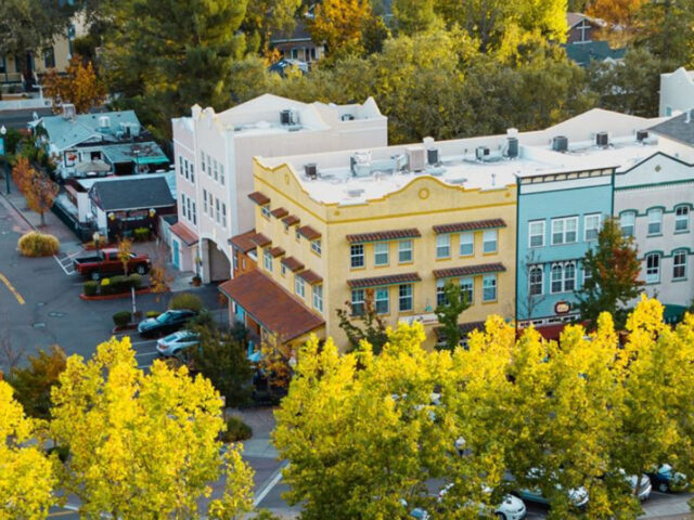 Colorful downtown buildings amid autumn trees