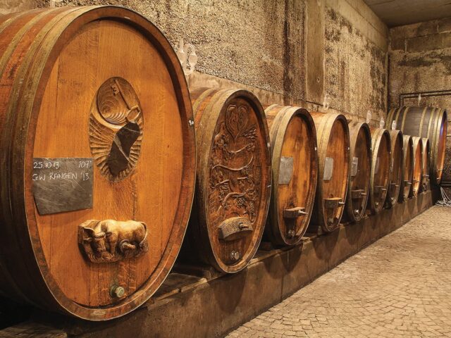 Large wooden wine barrels in cellar